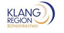 Das Logo der Klang Region Boheimkirchen zeigt eine stilisierte Musiknote in Blau, mit 'KLLANG' in fetten blauen Buchstaben darüber und 'REGION' in kleineren Buchstaben darunter. Unten steht 'Boheimkirchen' in kleinerer Schrift.