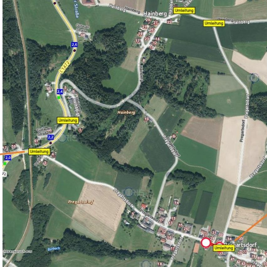 Eine Karte, die die Stadt Hainberg mit verschiedenen nummerierten Straßen und Wahrzeichen zeigt. Bemerkenswerte Punkte sind nummerierte Routen wie L4172, Umleitung und nummerierte Bereiche wie 29, 27 und 24. Die Karte hebt auch Pregartsdorf und Burbach als wichtige Orte hervor.