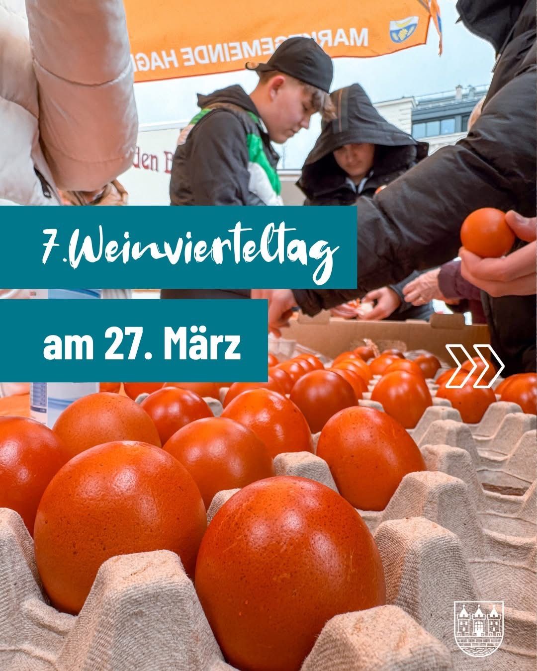 A group of people in winter clothing are sorting tomatoes in a box. The text on the image reads 7.Weinvierteltag am 27. März.