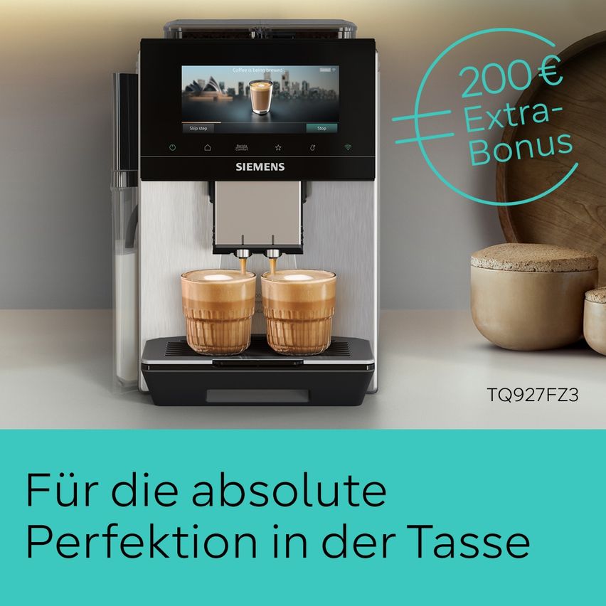 Siemens coffee machine with two cups of coffee. The machine displays a coffee image and has a 200€ extra bonus. The background is blurred with a wooden bowl and a cork lid.