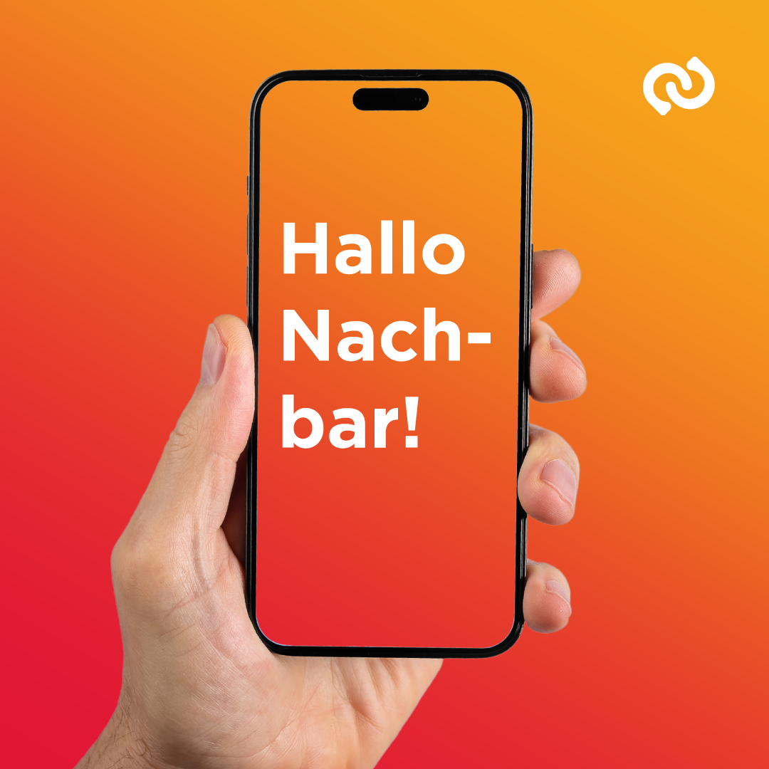 Ein Smartphone zeigt eine Nachricht mit 'Hallo Nachbar!' auf einem leuchtend roten Hintergrund. Eine Hand hält das Telefon und betont die Nachricht.