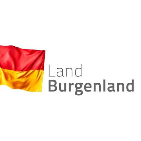 Das Bild zeigt die Flagge der Region Burgenland in Österreich mit einem roten, gelben und schwarzen Farbschema. Der Text 'Land Burgenland' ist in Fettschrift unter der Flagge angezeigt.