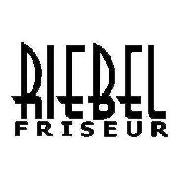 Ein schwarz-weißes Bild zeigt das Wort 'Riedel' in fetten stilisierten Buchstaben über dem Wort 'Friseur', was auf Deutsch Friseur bedeutet.