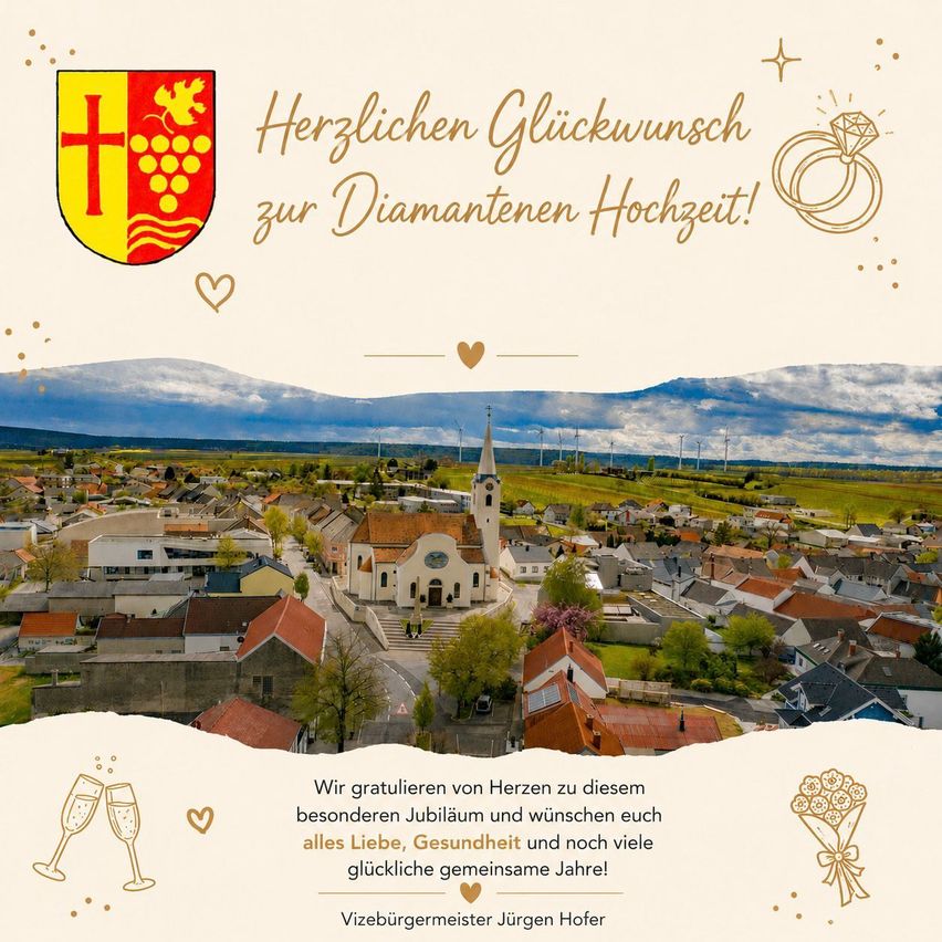 A town with houses, a church, and a mayor's message. The town is set against a backdrop of green hills and a clear sky. The mayor's message reads 'Herzlichen Glückwunsch zur Diamantenen Hochzeit!' in gold lettering. There is a watermark of a logo in the top left corner.