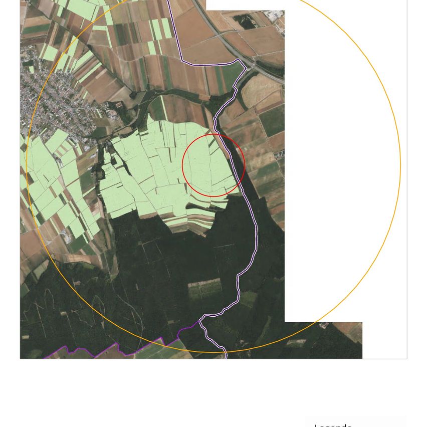 Aerial view of a rural area with green fields, a red circle highlighting a specific area, and a yellow line marking a path.