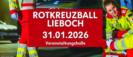 Ein roter Banner mit weißem Text zeigt 'ROTKREUZBALL LIEBOCH 31.01.2026'. Zwei Personen in roten und gelben Uniformen stehen neben einem roten Fahrzeug.
