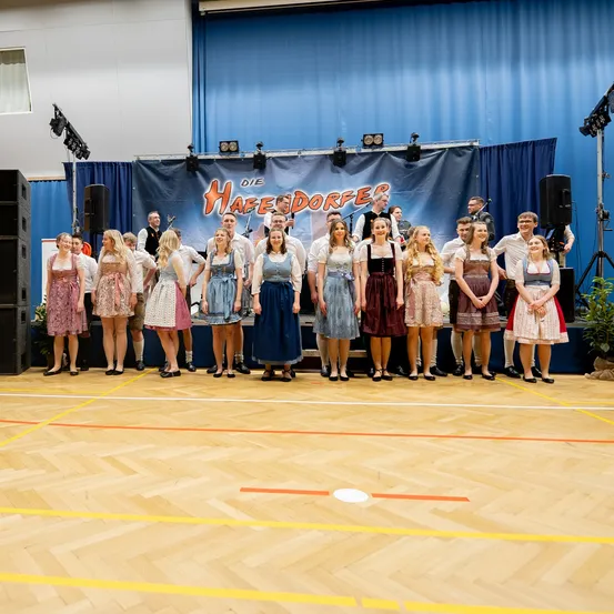 Stage, Floor, Flooring, Person, Dress, Microphone, People, Wood, Group Performance, Formal Wear