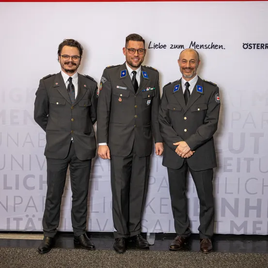 Logo, Suit, Adult, Male, Man, Person, Coat, Symbol, Shoe, Officer