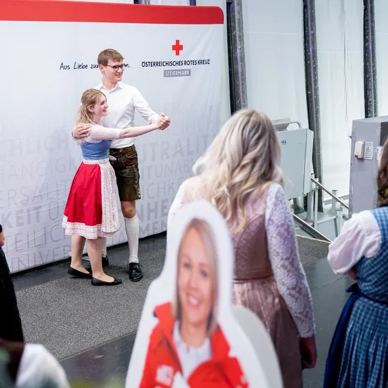 Logo, Symbol, Person, Adult, Female, Woman, Red Cross, Shorts, Face, Shoe