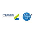 Das Bild zeigt ein Logo für Klima- und Energie-Modellregionen mit weißem Hintergrund und einem blauen Kreis mit weißem Text, der 'klima+energie fonds' lautet.