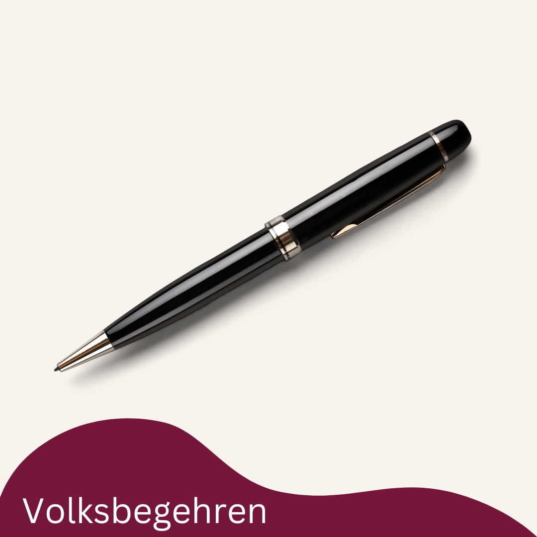 Ein schwarzer Füllfederhalter mit goldener Einfassung ruht auf einem weißen Hintergrund. Darunter steht das Wort 'Volksbegehren' in weiß geschrieben.