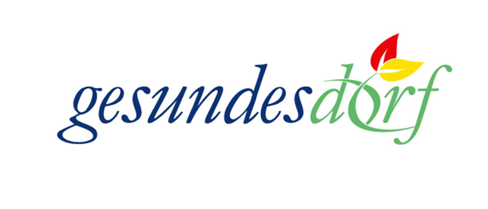 Das Logo einer gesundheitsorientierten Initiative lautet 'gesundes dorf' mit einem stilisierten Blatt.