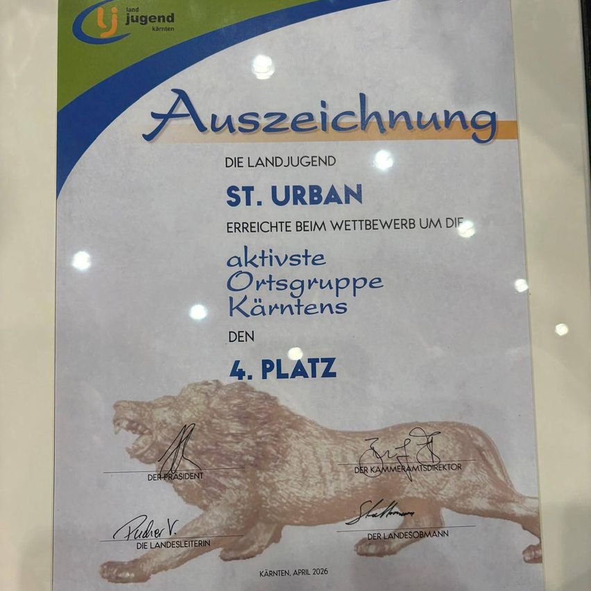 Auszeichnungsurkunde für St. Urban erreichte den 4. Platz in einem Wettbewerb für die aktivste Ortsgruppe von Kärnten. Sie ist unterzeichnet vom Präsidenten, dem Kammerdirektor und dem Landeshauptmann. Die Urkunde zeigt ein Löwenbild und ein Wasserzeichen von Kärnten im April 2026.