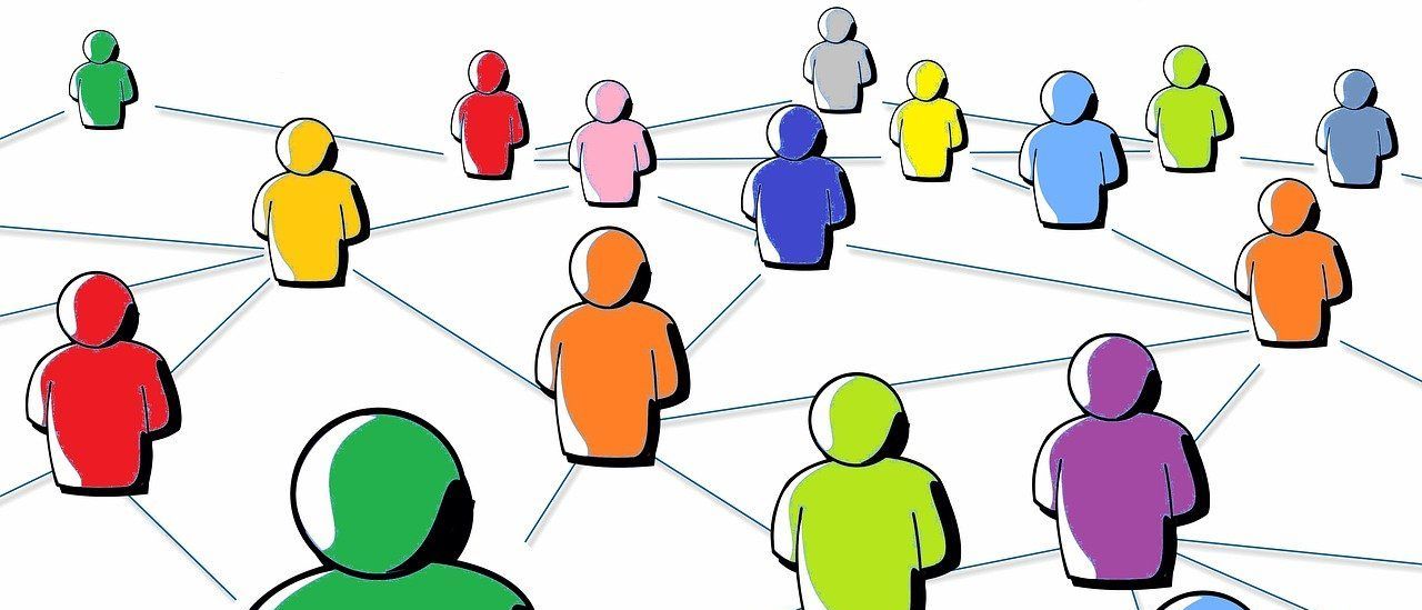 Eine Illustration zeigt eine Gruppe von Menschen in verschiedenen Farben, die durch Linien verbunden sind. Eine grüne Figur sticht hervor.