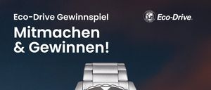Eine silberne Citizen-Uhr mit rotem Zifferblatt und schwarzem Rand, Eco-Drive-Funktion und passendem Kampagnenslogan.