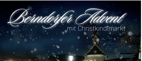Berndorfer Advent mit Christkindmarkt. Ein Markt im Freien mit Ständen und einem Lagerfeuer im Schnee.