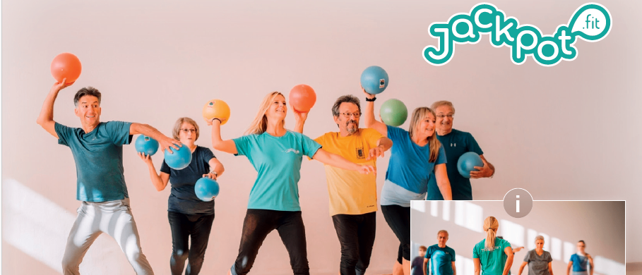 Eine Gruppe von Menschen in einem Fitnessstudio, die Übungsbälle halten, lächeln und in die Kamera schauen. Das Bild hat einen Wasserzeichen mit dem Text 'Jackpot'.