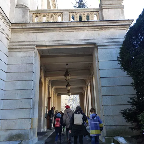 Person, Walking, City, Adult, Female, Woman, Building, Coat, Jacket, Portico