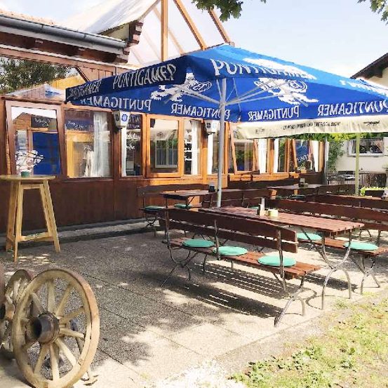 Bild enthält, Wood, Wheel, Cafe, Indoors, Restaurant, House, Housing, Patio, Patio Umbrella, Canopy