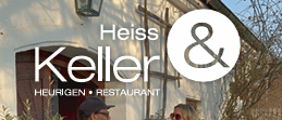 Eine Werbung für das Heiss Keller Restaurant zeigt zwei singende Personen auf der Bühne. Adresse, Telefonnummer und Website sind angegeben.