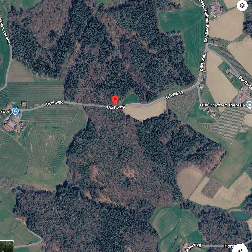 A satellite image shows an aerial view of a rural area with roads, houses, and fields. A marked location indicates a specific point of interest.