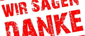 Ein roter Stempel mit weißem Rand sagt Wir sagen Danke, was im Englischen Wir sagen Danke bedeutet. Die Buchstaben sind in einer verwitterten Schrift gedruckt.