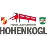 The logo for the Hohenkogl Volunteer Fire Department features a red building, a shield with a fire and wheel, and a green shield with trees.