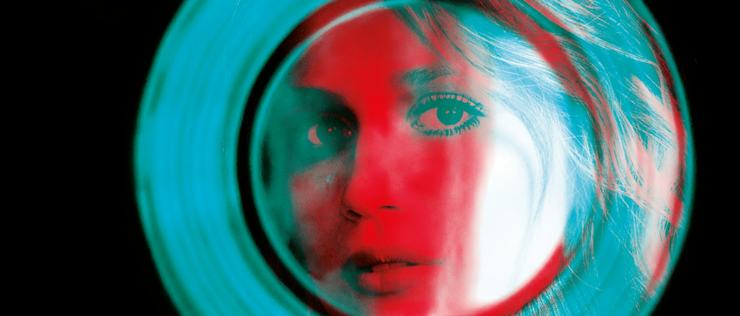 Das Cover zeigt ein stilisiertes Bild eines Frauengesichts, das in einem grünen Kreis reflektiert wird, vor schwarzem Hintergrund. Der Titel 'Eichenauer' ist oben und 'Die Aussen' unten prominent angebracht.