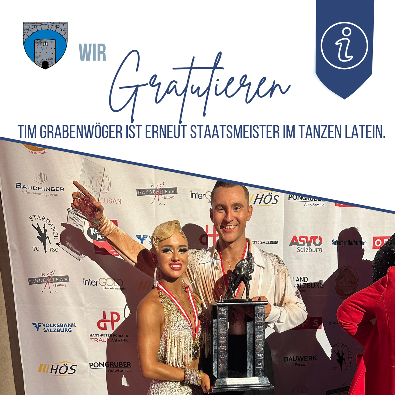 Two people, a man and a woman, are standing and holding a trophy with a horse statue on it. The man is wearing a medal. The image has a blue border.