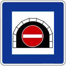 A blue sign with a white arch contains a red circle with a white bar, indicating a prohibition or closure.