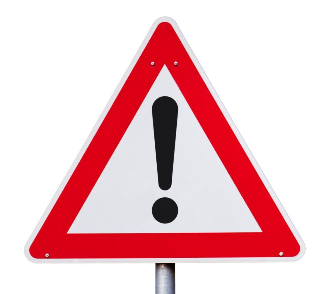 A triangular warning sign with a red border and a white triangle in the center containing a black exclamation mark.