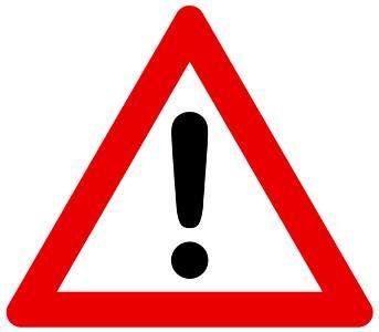 Ein rotes Dreieck mit einem schwarzen Ausrufezeichen in der Mitte, das vor potenzieller Gefahr warnt.