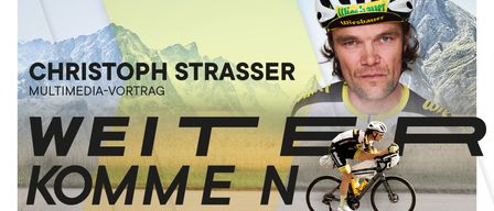 Ein Radfahrer fährt auf einer Straße mit Bergen im Hintergrund. Ein Mann mit Helm und Radtrikot erscheint. Der Text 'Beit Emmen' ist in fetten Buchstaben zu lesen.