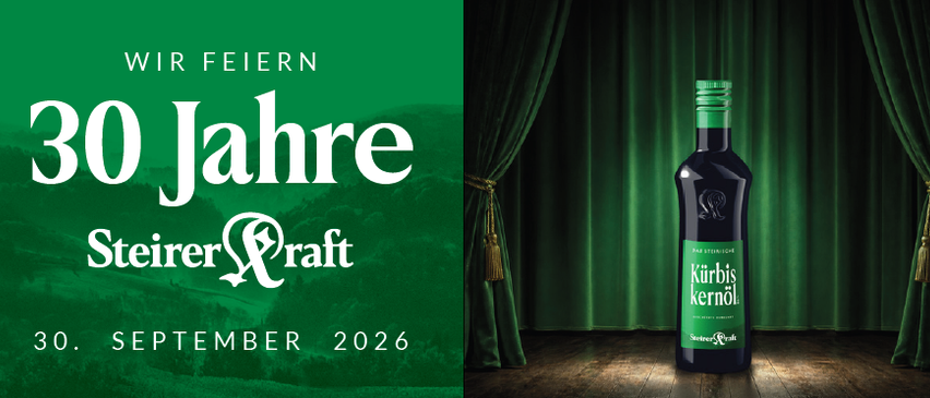 A bottle of Kurbis kernl liquor stands on a wooden surface in front of a green curtain, celebrating 30 years of Steirer Kraft. The text 'Wir feiern 30 Jahre' and 'Steirer Kraft' is displayed on a green background.