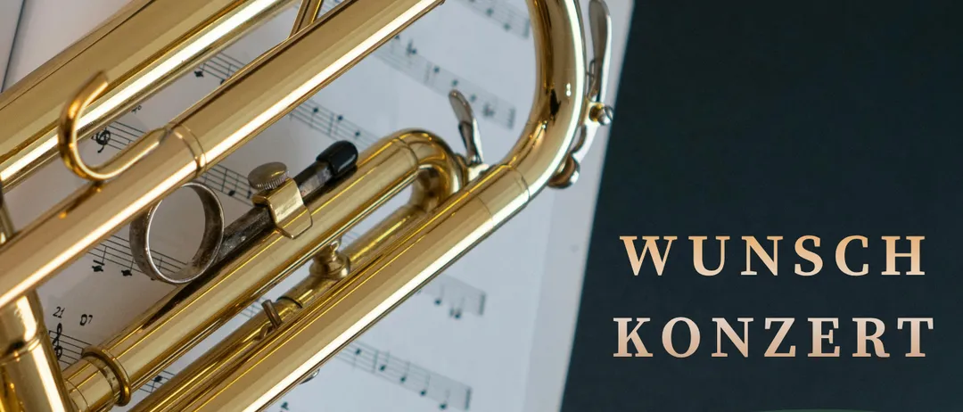 Eine goldene Trompete liegt auf einem Notenblatt, mit dem Text 'Wunsch Konzert' und 'Freitag, 12. März 2027' auf dem Plakat.