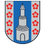 Ein Schild mit blauem und weißem Hintergrund zeigt einen zentralen weißen Turm mit einem spitzen Dach, umgeben von sechs roten Blumen, drei auf jeder Seite des Turms.
