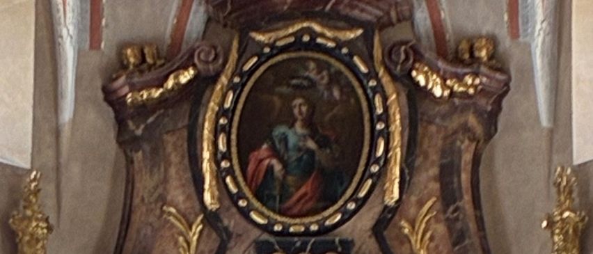 A grand altarpiece in a church with intricate gold and marble details, a central painting of a religious scene, and statues on either side.