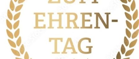 Eine goldene Lorbeerkrone mit einer Krone oben und dem Text 'Zum Ehren-Tag' in fetten Buchstaben, drei Sterne darunter und einem Banner mit dem Wort 'Stock'.