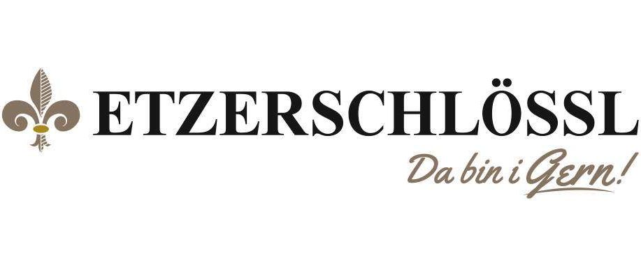 Etzerschloss Logo mit dem Namen 'Etzerschloss' in Schwarz und dem Slogan 'Da bin i gern' in Braun.