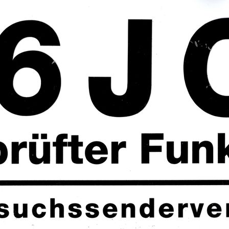 Schwarzer Text zeigt die Nummer 6JO auf weißem Hintergrund. Darunter steht in kleinerem Text 'rufer Funk' und darunter 'suchssenderve'.