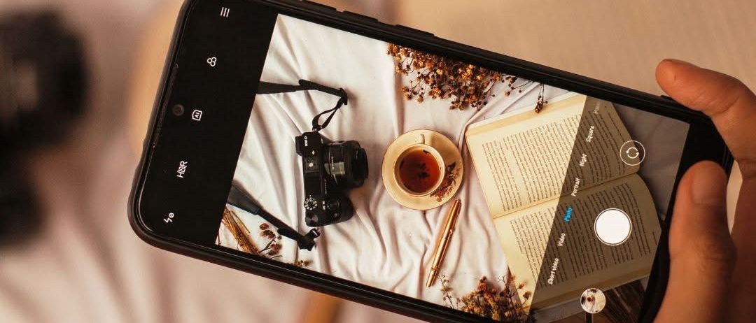 Image contains, Electronics, Mobile Phone, Phone, Iphone, Beverage, Coffee, Coffee Cup