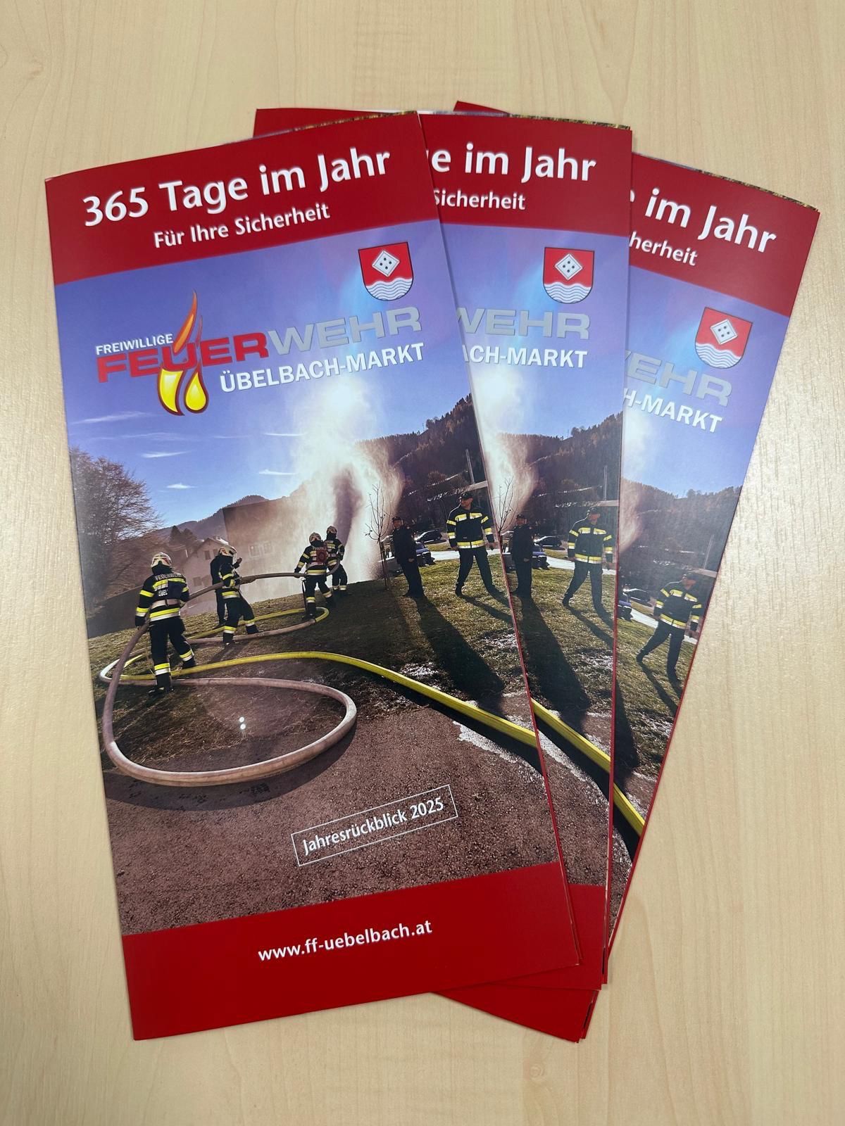 Three flyers for the Ueelbach-Markt fire department, featuring firefighters in action. The cover reads 365 days for your safety.