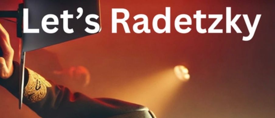 Ein bärtiger Mann in einer Militäruniform mit goldenen Akzenten, Sonnenbrille und Kopfhörern tritt auf einer Bühne mit roter Beleuchtung und einem Scheinwerfer auf.