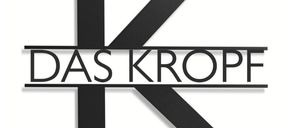 Das Logo für 'Das Kropf' ist auf weißem Hintergrund dargestellt. Es zeigt ein stilisiertes 'K' in Schwarz, mit dem Wort 'DAS' darüber und 'KROPF' darunter, was ein zusammenhängendes Design bildet.