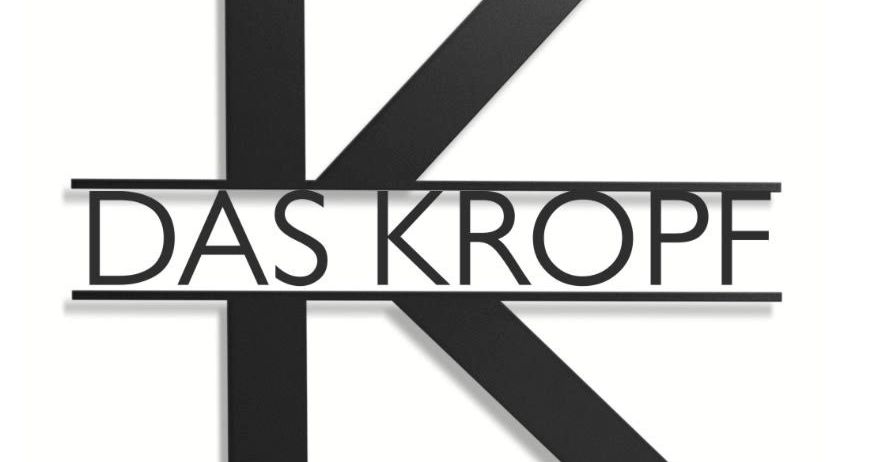 Das Logo für 'Das Kropf' ist auf weißem Hintergrund dargestellt. Es zeigt ein stilisiertes 'K' in Schwarz, mit dem Wort 'DAS' darüber und 'KROPF' darunter, was ein zusammenhängendes Design bildet.