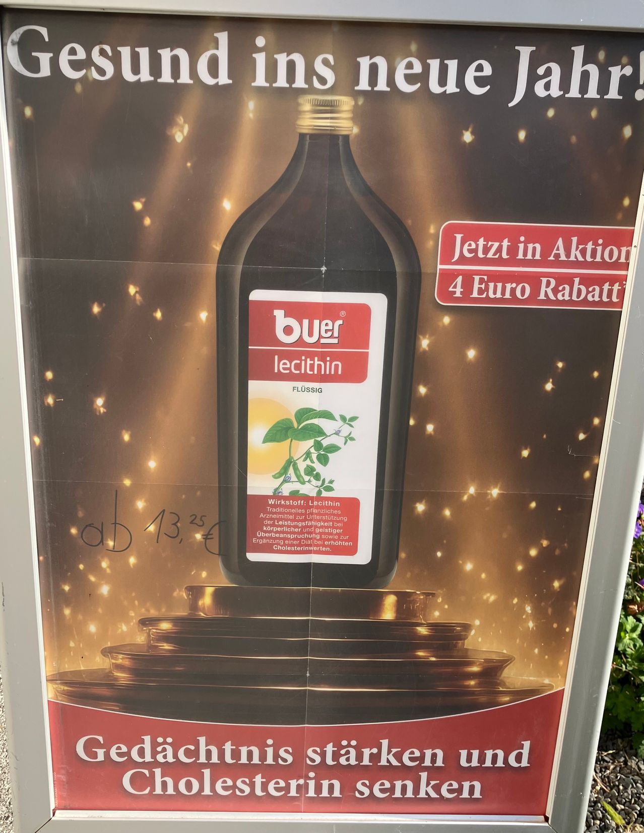 A promotional poster for Buer Lecithin. It features a bottle of Lecithin, with a price tag of 13.25 euros, and a red sign offering a 4 Euro discount. The poster also includes a trophy and a sparkling background.