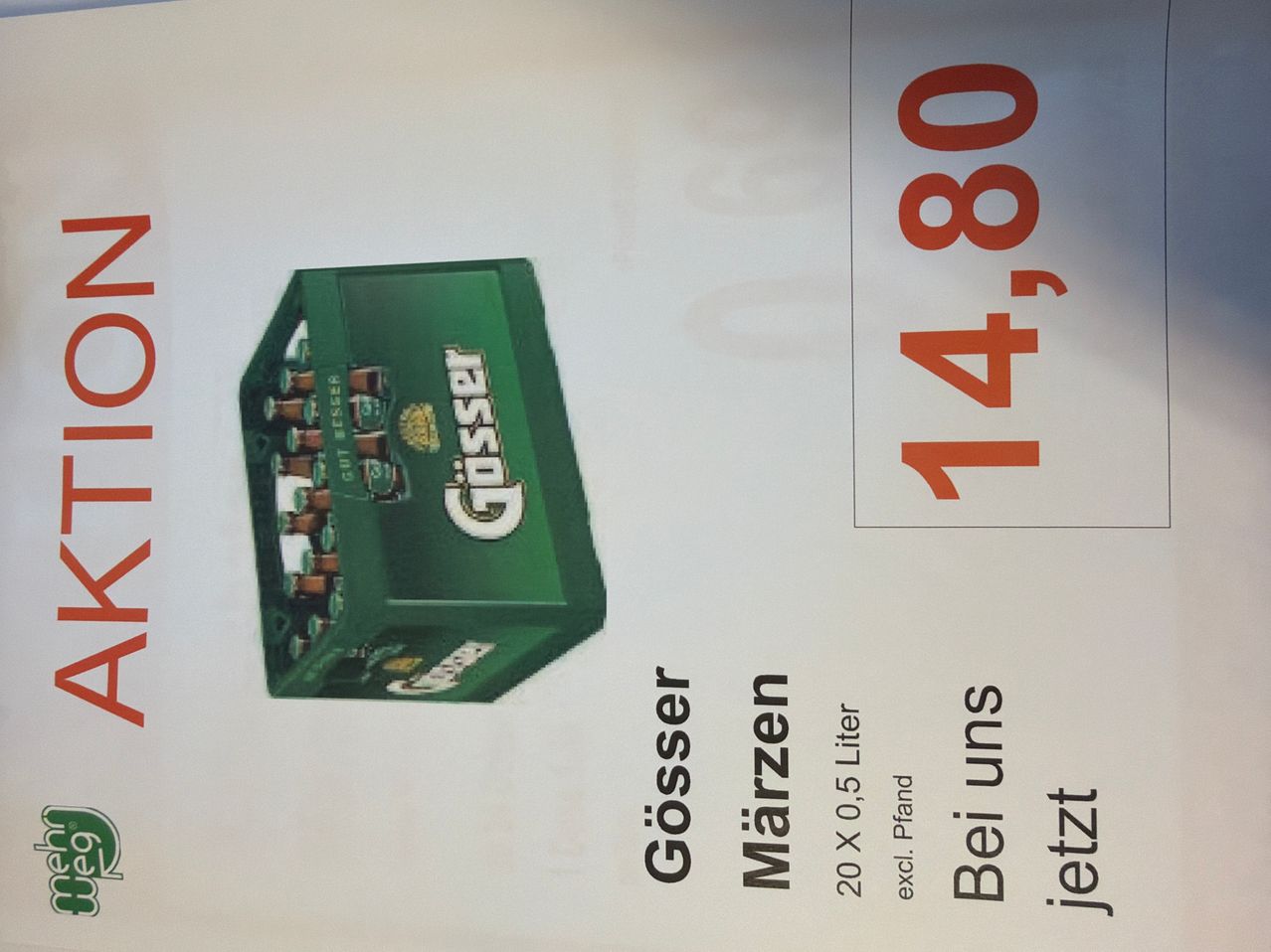 Ein Werbeplakat für Gosset Bier, mit einer grünen Box, dem Markennamen und einem Preis von 14,80.