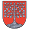 Ein roter Schild mit einem in Grau gezeichneten Baum mit herzförmigen Blättern. Der Baum wurzelt in einem kleinen grauen Hügel.