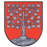 Ein roter Schild mit einem in Grau gezeichneten Baum mit herzförmigen Blättern. Der Baum wurzelt in einem kleinen grauen Hügel.