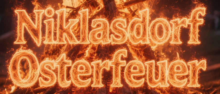 Ein Lagerfeuer mit den Worten Niklasdorf Osterfeuer 04.04 brennt in der Nacht hell.